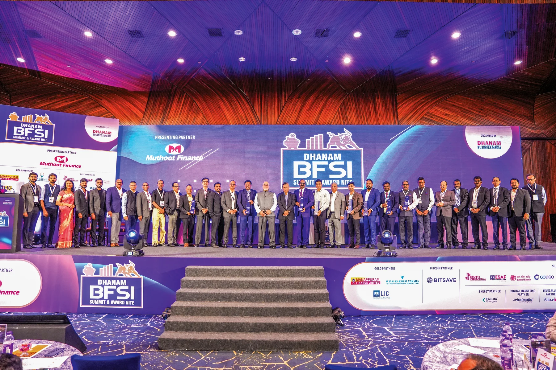 Award recipients and guests on stage at a previous Dhanam BFSI Summit & Award Nite